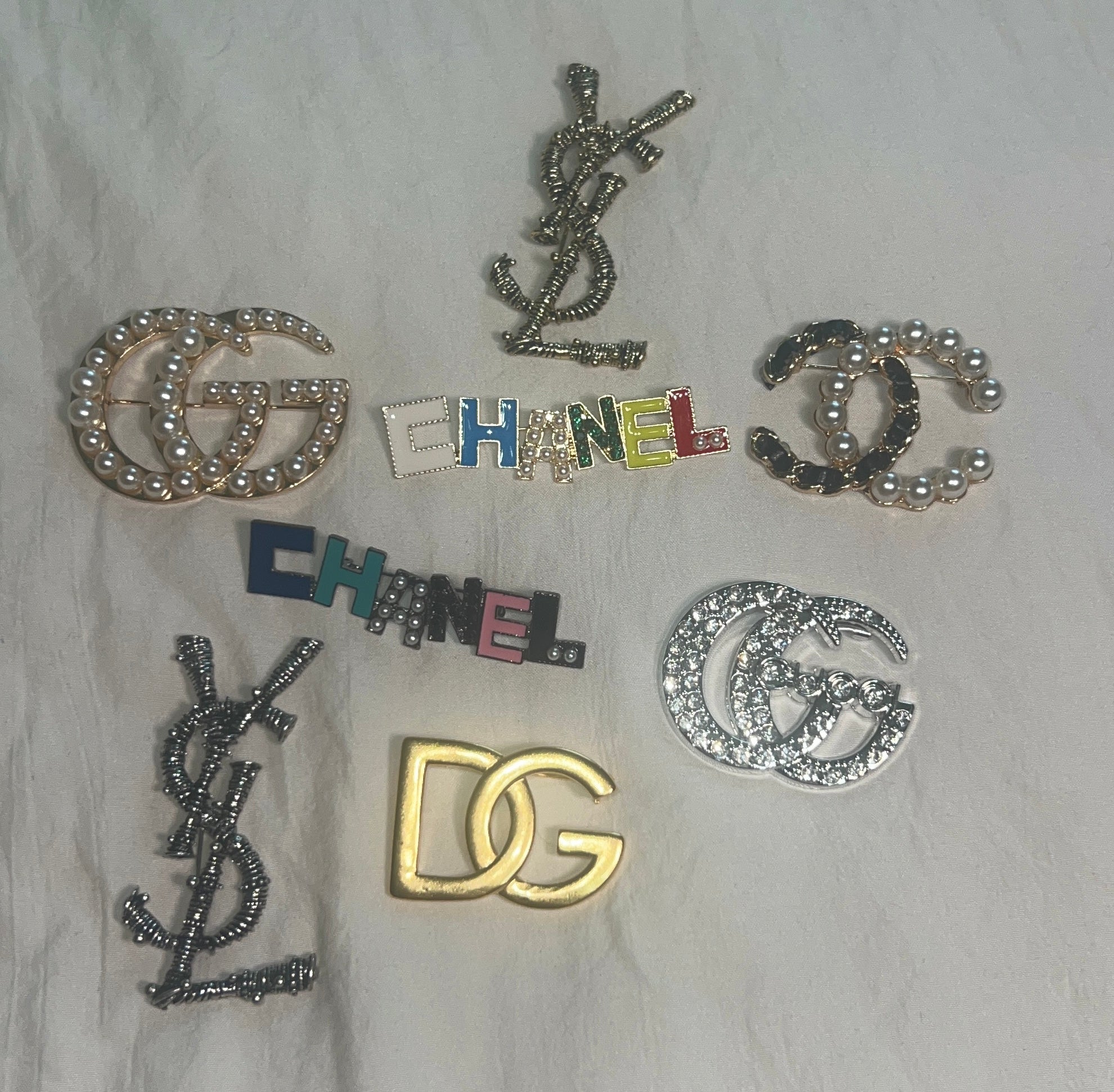 Monogram Broches