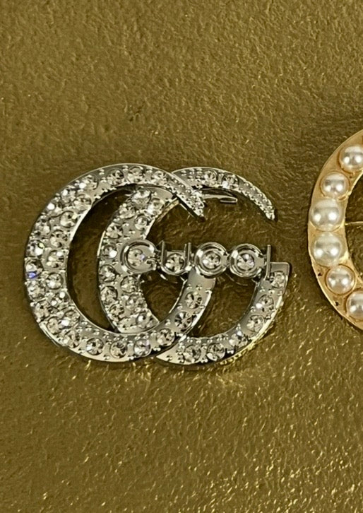 Monogram Broches
