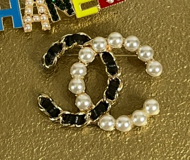 Monogram Broches